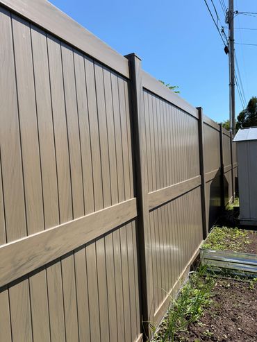 Grey Vinyl Fence with Wood Grain 