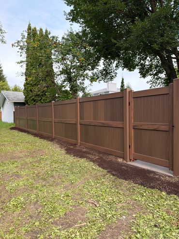 Vinyl Fence with a Wood Grain.
