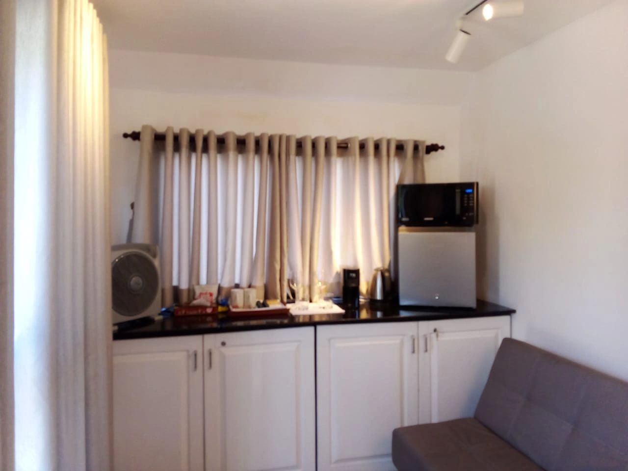 Grand Rover luxury caravan kitchenette and lounge inside movable hotel suite Sri Lanka.