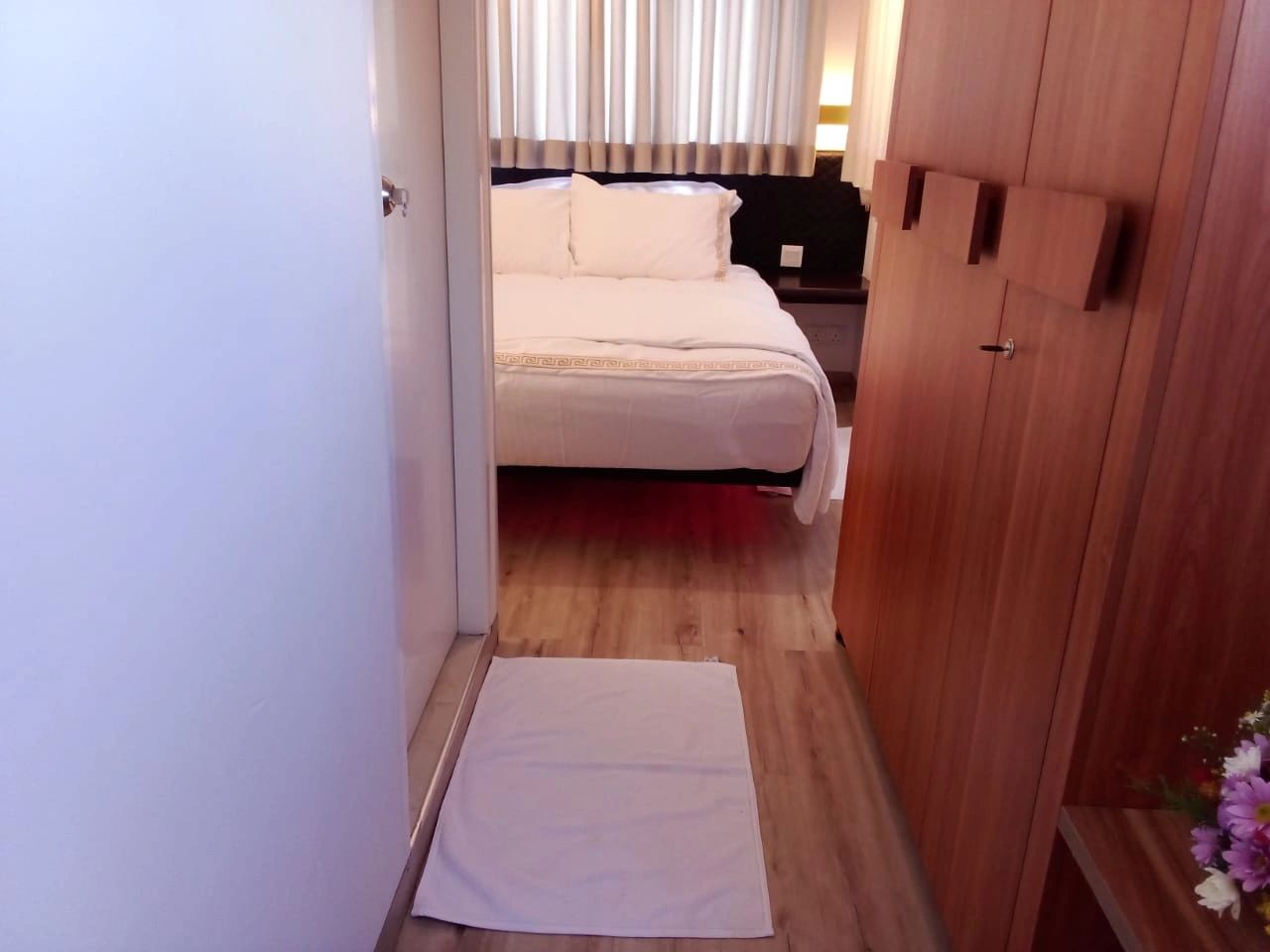 Grand Rover luxury caravan bedroom interior with comfortable double bed and premium wooden finishes 