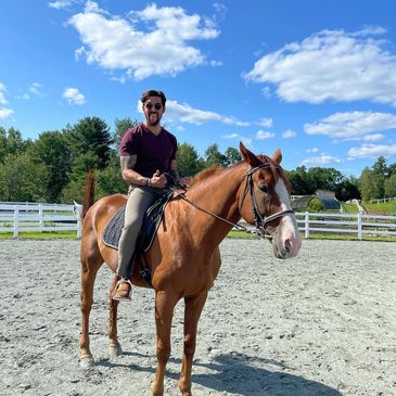 Tom behind the scenes riding the horse named Barkley on set of If I Could Ride.