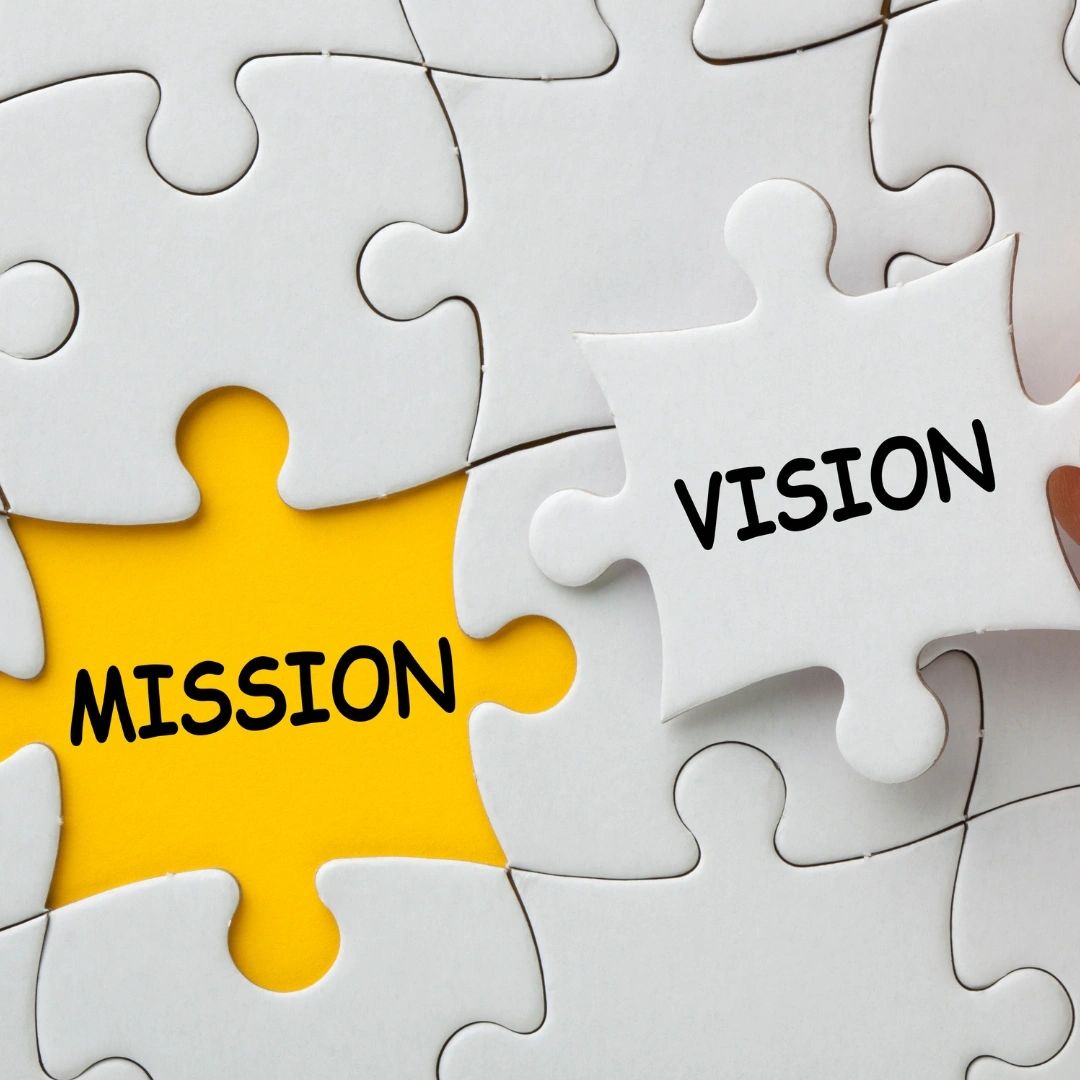 Puzzle pieces labeled Mission and Vision fitting together.