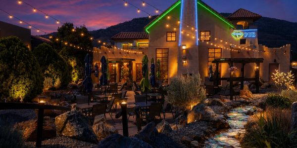 The Ridge Pub & Restaurant patio, illuminated at twilight.