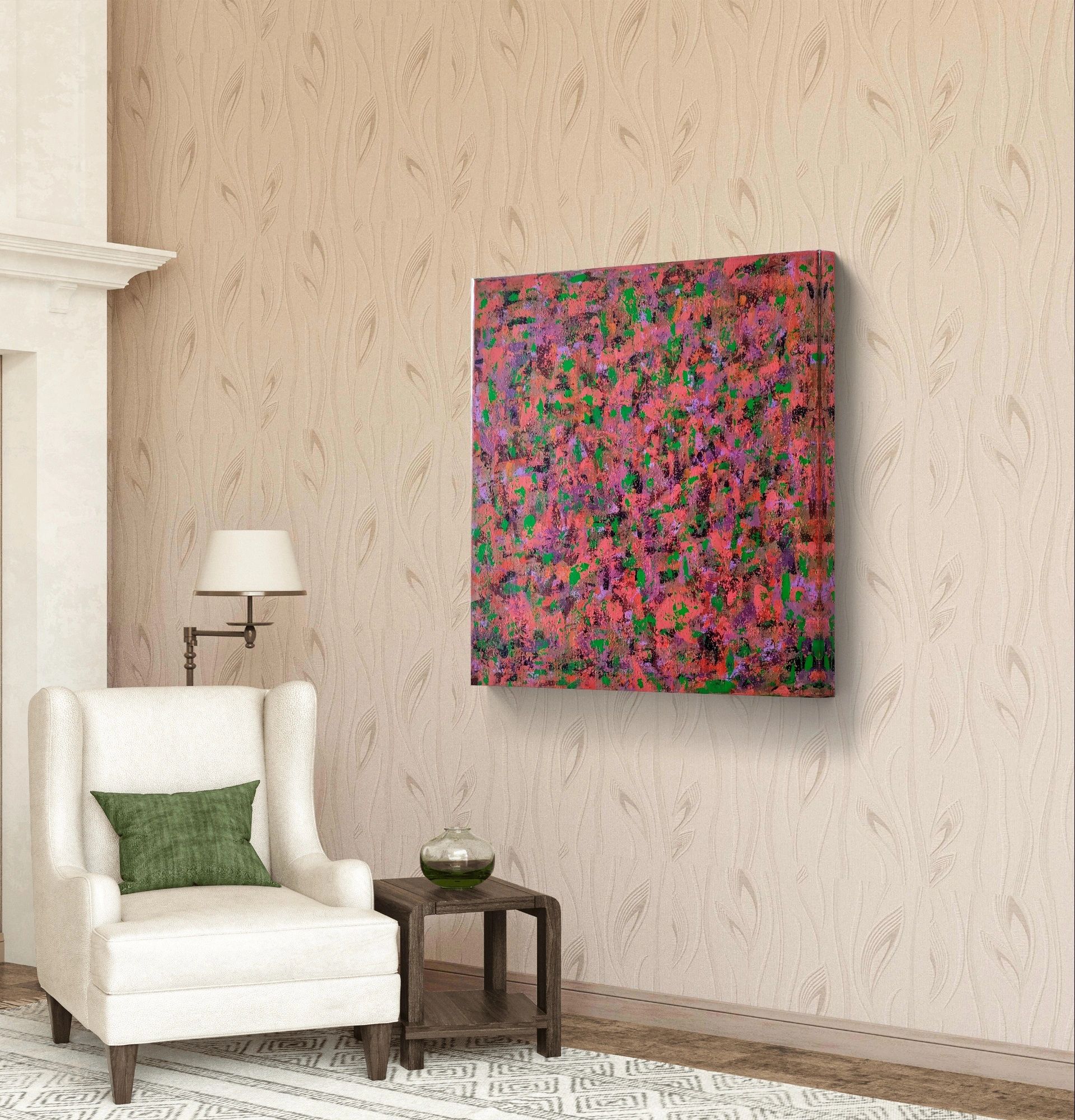 Abstract pink and green painting hanging on a beige wall