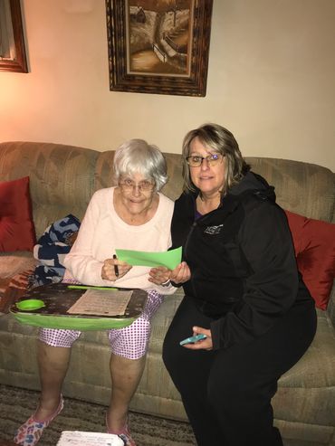 My wife, Paula, presenting a surviving veterans spouse with a certificate for  Christmas Dinner. 