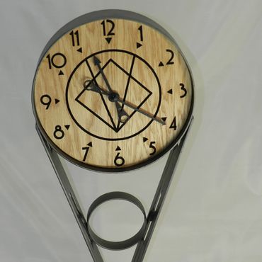 Steel and wood very cool deco  clock sculpture.  30" tall.