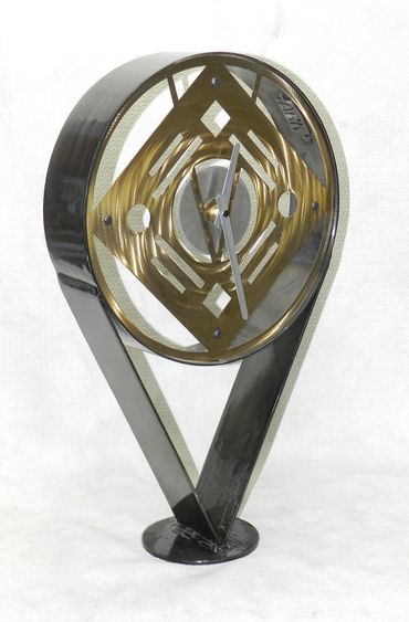 Gold and black powder coated clock sculpture sold at westport 2022.  One of my favorite shapes. And 