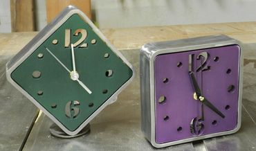 A cool new pair of steel and anodized aluminum clocks.  Only 6x6.