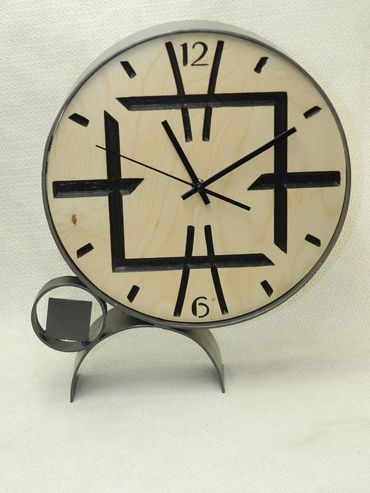 Modern deco steel and wood sculpture clock.