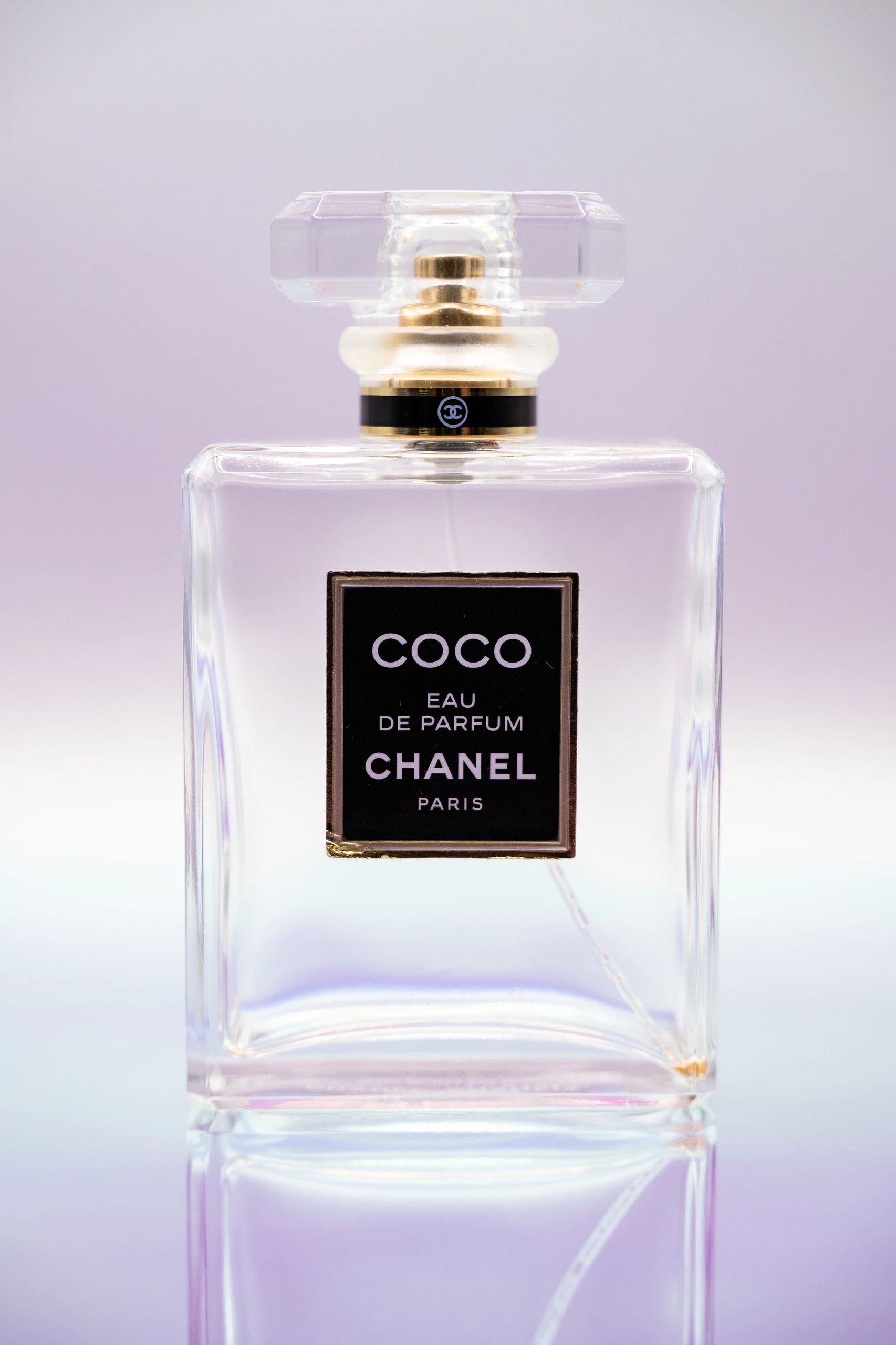 Elegant Chanel Coco Eau de Parfum bottle with a clear design and black label.