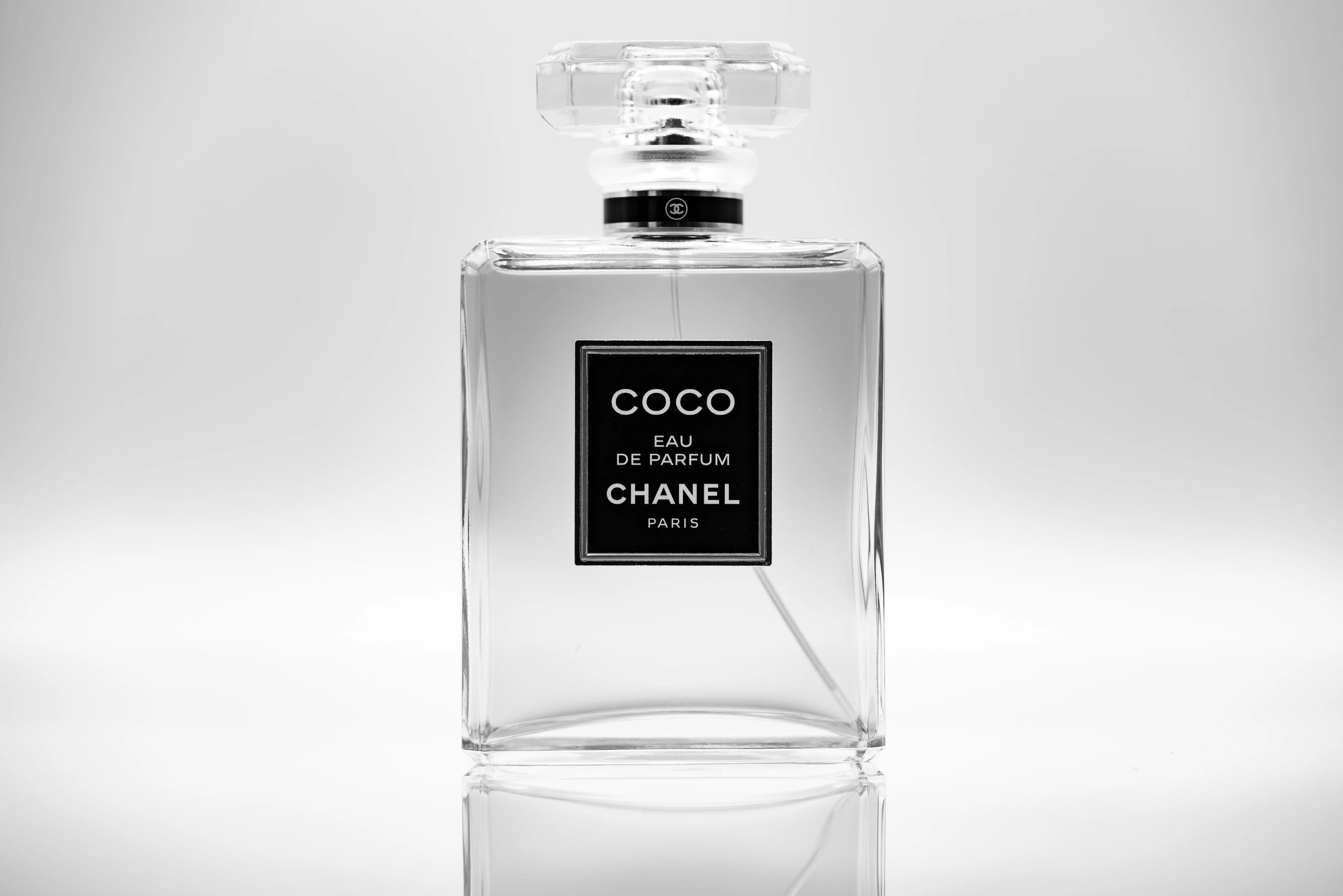 Elegant Chanel Coco Eau de Parfum bottle in black and white.