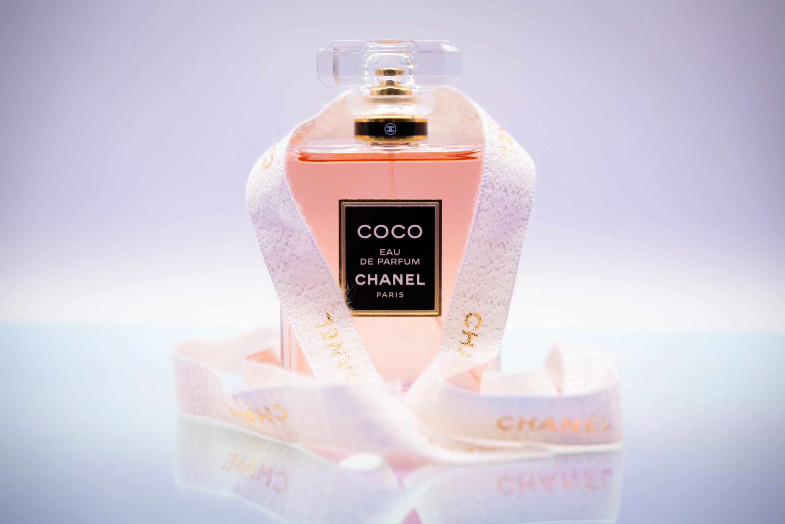 Chanel Coco Eau de Parfum bottle with a delicate ribbon.