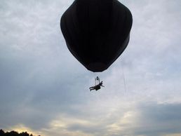 Home built experimental ultralight solar/propane hybrid hot air balloon with sky-walker harness.