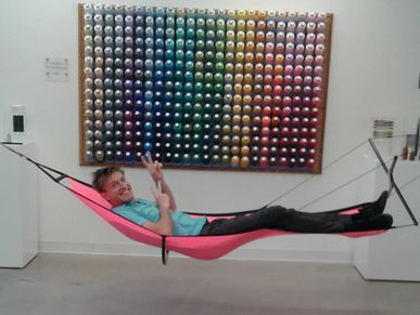 Zach in A Quadrecline™ Hammock in the lobby of AFOA at MIT