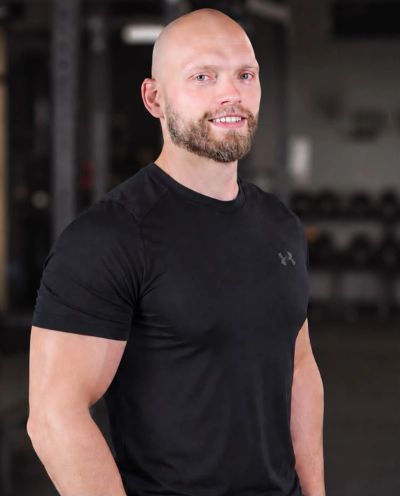 Smiling muscular man in black t-shirt
