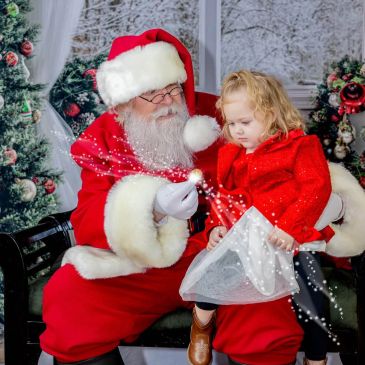 Santa Claus and a child sharing a magical moment.