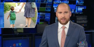 News anchor reporting with a graphic of a child holding an adult's hand.