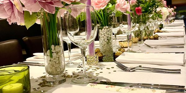 Elegant table setting with flowers and candles for a formal event.