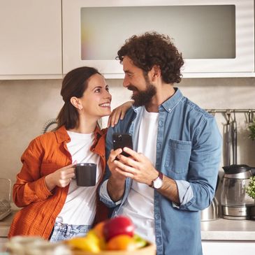 Happy couple participating in relationship therapy, improving communication and connection in Denver