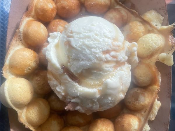 maple ice cream over a house bubble waffle.