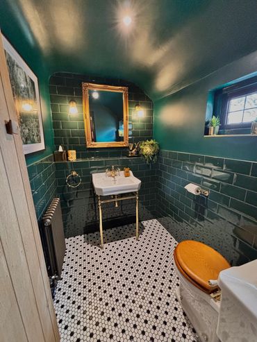 Burlington basin with green metro wall tiles black and white mosaic floor tiles 