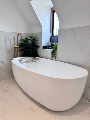 Beautiful freestanding Lusso Stone Bath and tap 