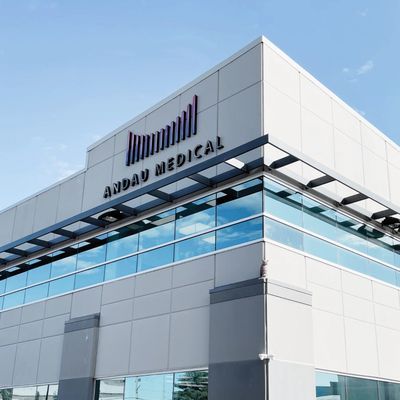 Modern medical building with Andau Medical signage against blue sky.