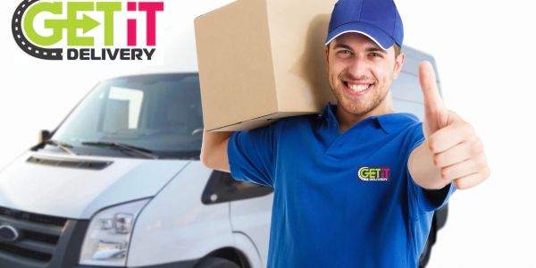 Delivery man with box giving thumbs up.