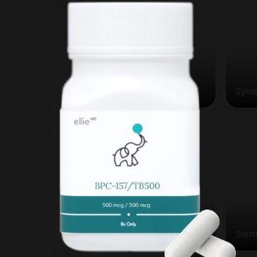 White pill bottle labeled BPC-157/TB500 with two capsules beside it.