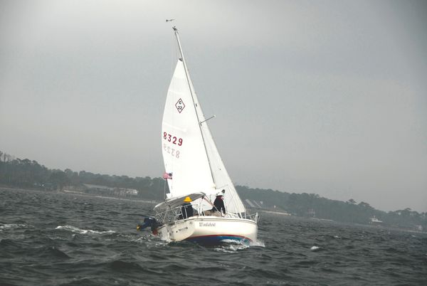 The author and his wife sailing on the edge of a storm along the northern Gulf Coast.