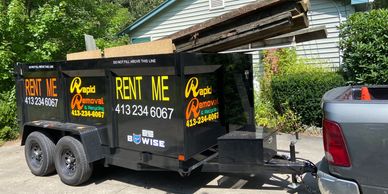 A promotional image for dumpster rental services in Seattle, Washington, featuring a large dumpster and city skyline in the background.