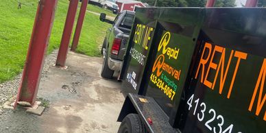 A truck rental advertisement featuring a Michigan landscape, promoting truck rental services in the state.