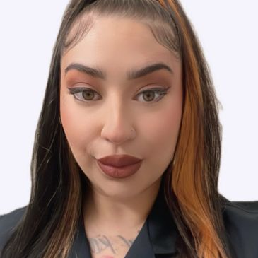 Close-up portrait of a woman with styled hair and makeup.