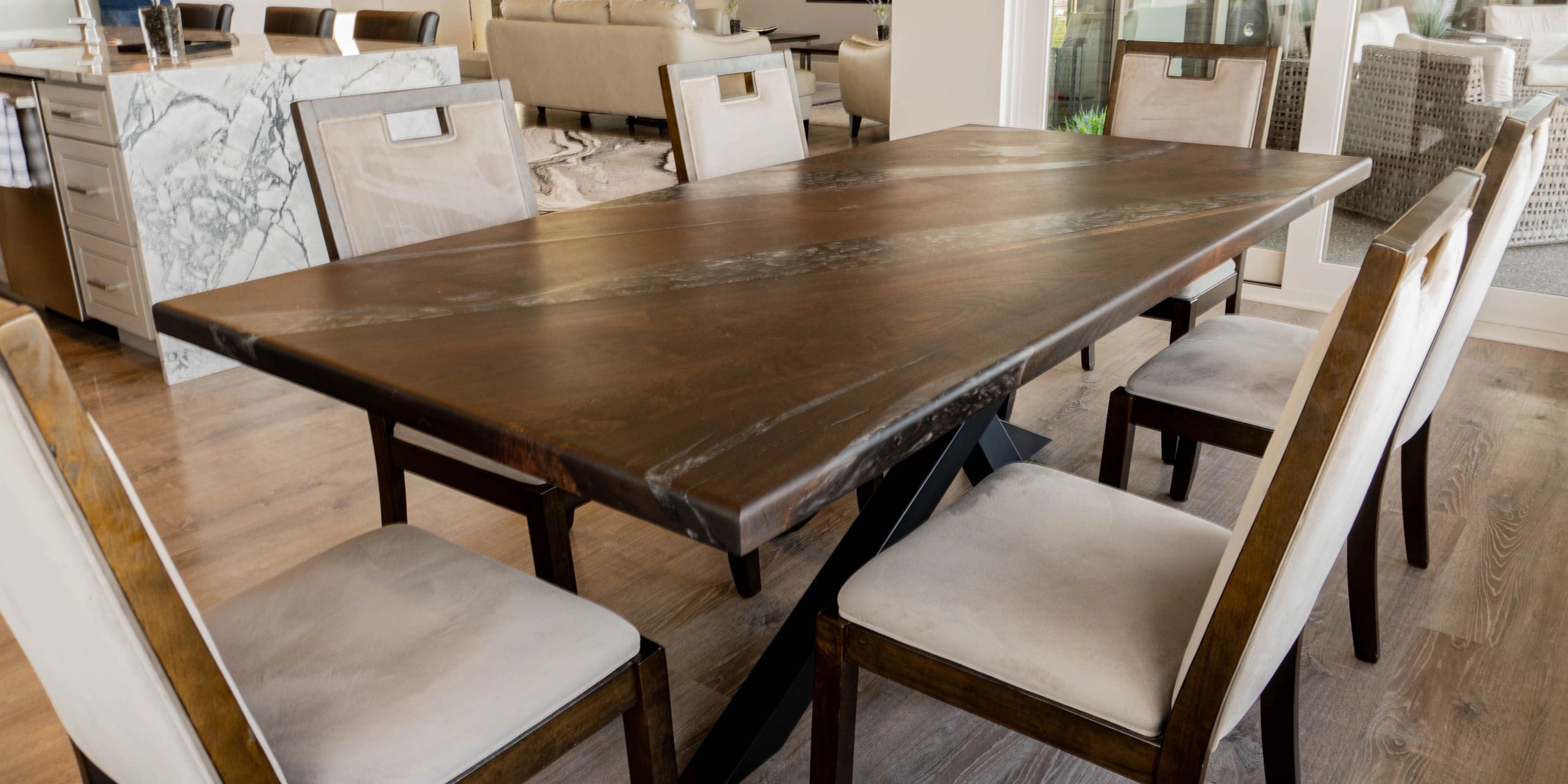 A custom live edge black walnut dining table with epoxy in Aspen, Colorado