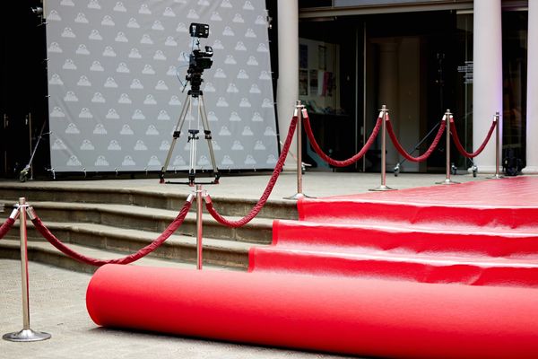 a red carpet being installed 