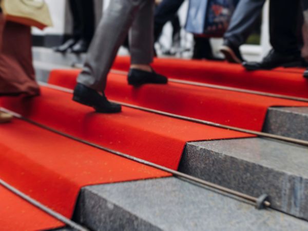 closeup shot of red carpet stairs 