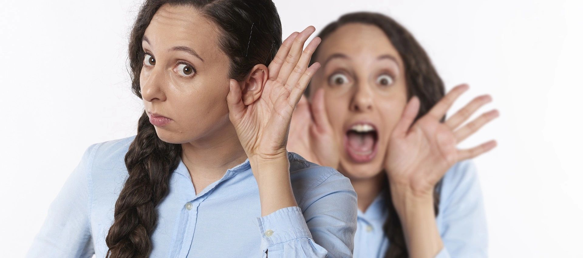 A woman listens intently while her blurred self shouts behind her.