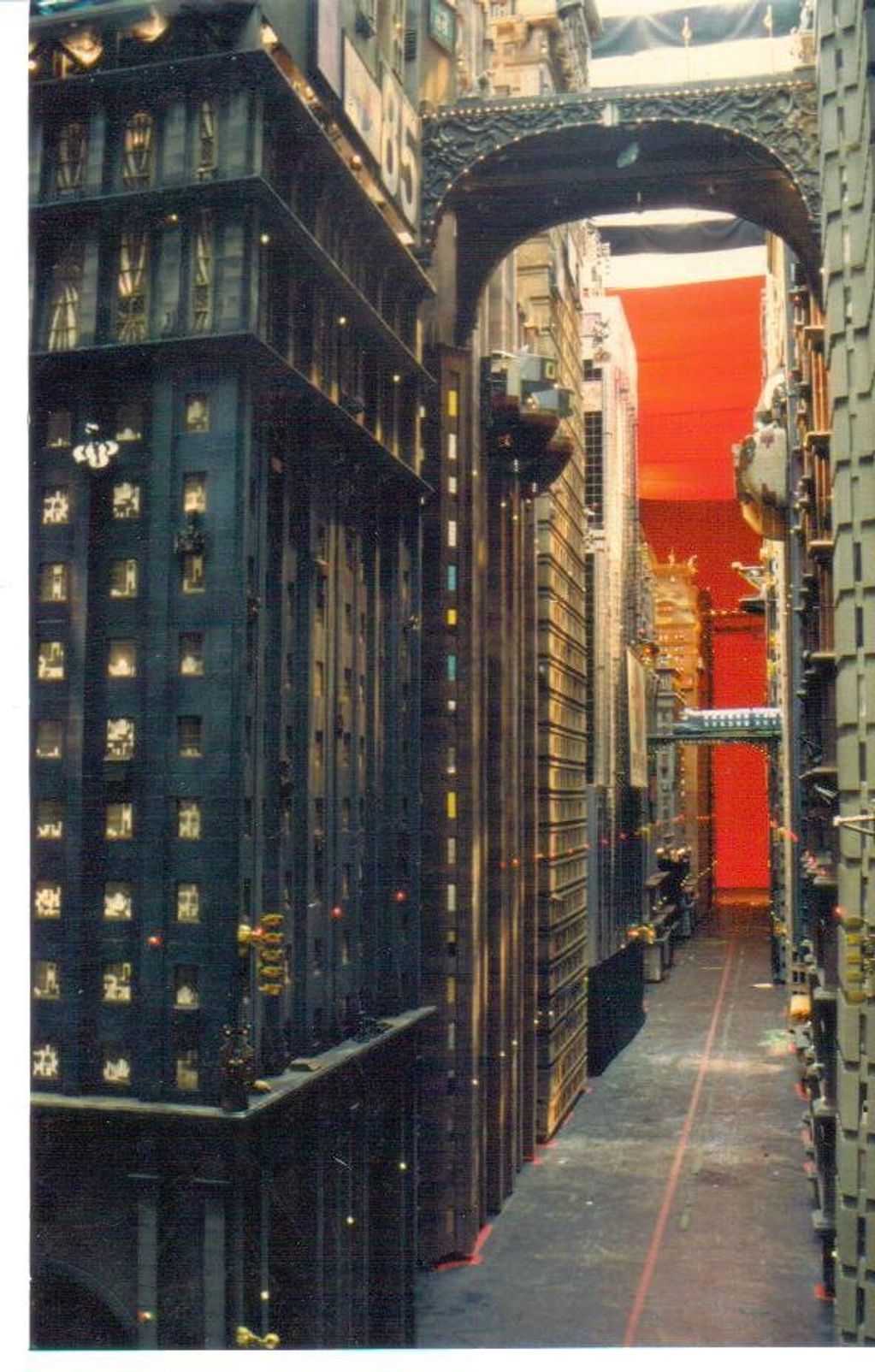 A series on miniature buildings with an orange screen in the background.
