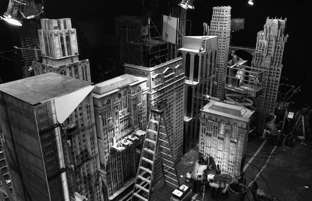 Black and white photo, overhead view of the model buildings - a 12 step ladder is in the middle.