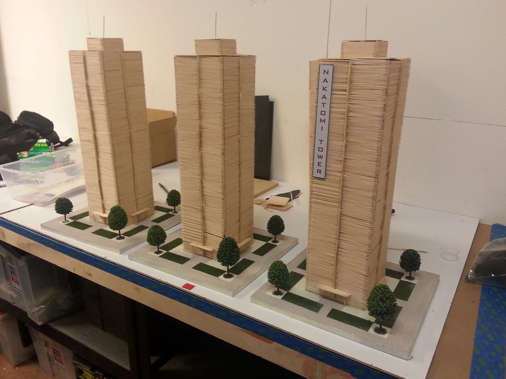 Image of three skyscraper models.  They are tan in color.  One has a Nakatomi Plaza sign on it.