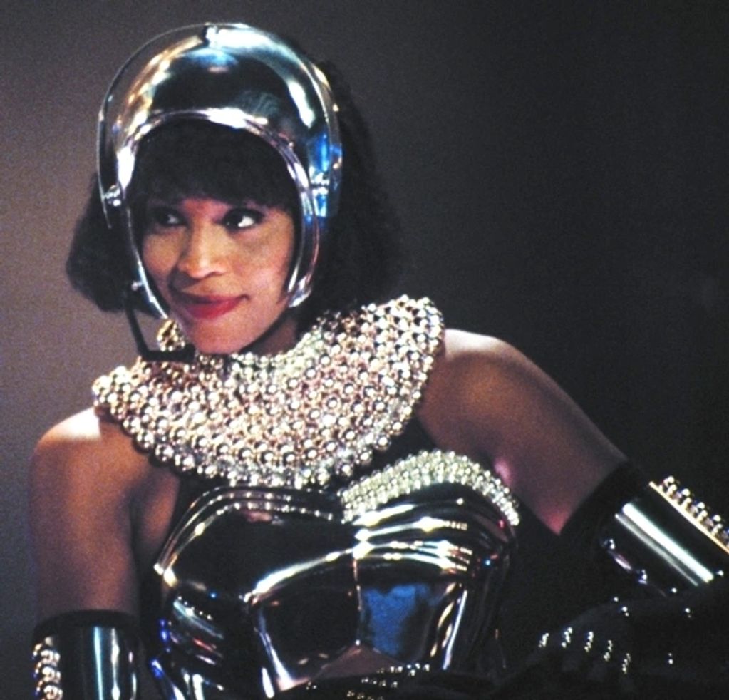 Whitney Houston in the iconic Bodyguard costume. It is a highly polished silver.