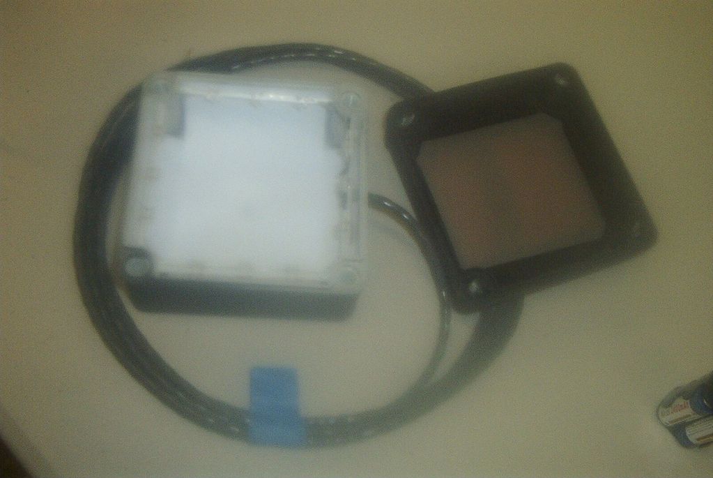 Image shows an open box. It has color and diffusion sources along with LEDs and wiring exposed.