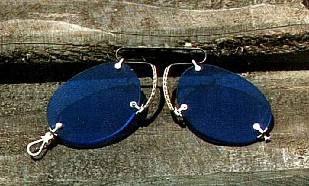 Image of silver framed pince nez glasses with blue lenses.