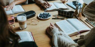 People studying together with books and coffee.