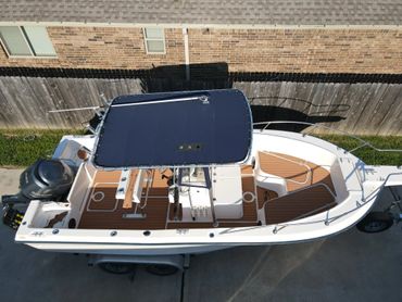 teak and black maxx tread flooring on a grady white boat with teak lines and custom logos. EVA/PE