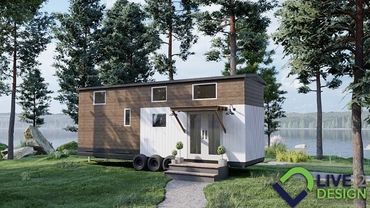 3D Render of a tiny home on wheels parked next to a lake 