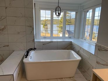 bathroom renovation with corner windows