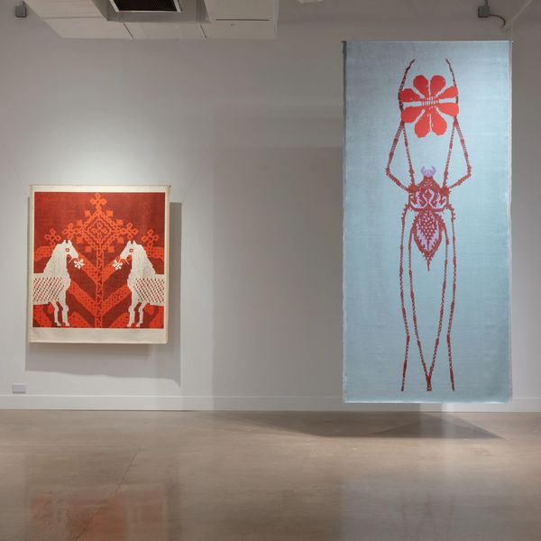 Two textile artworks featuring stylized animal and insect designs in a gallery space.
