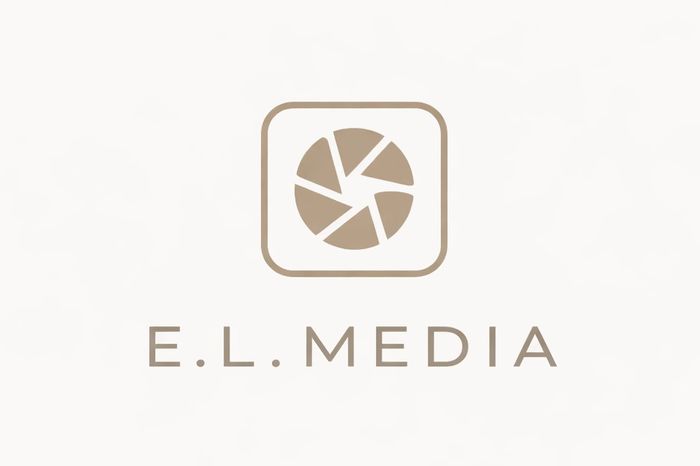 Minimalist logo for E.L. Media featuring a camera shutter icon and clean typography.