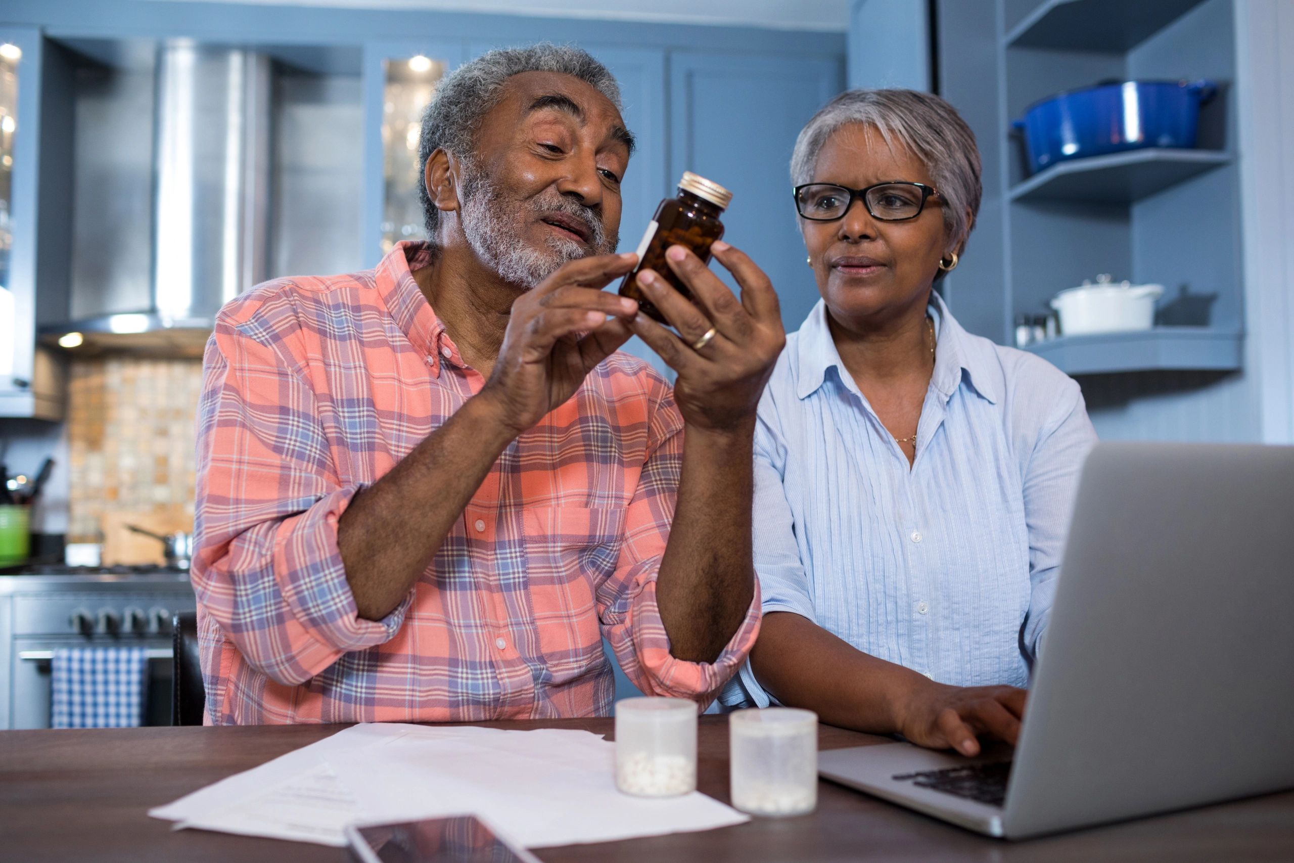 Part D Medicare prescription drug coverage African American couple husband and wife with medicine